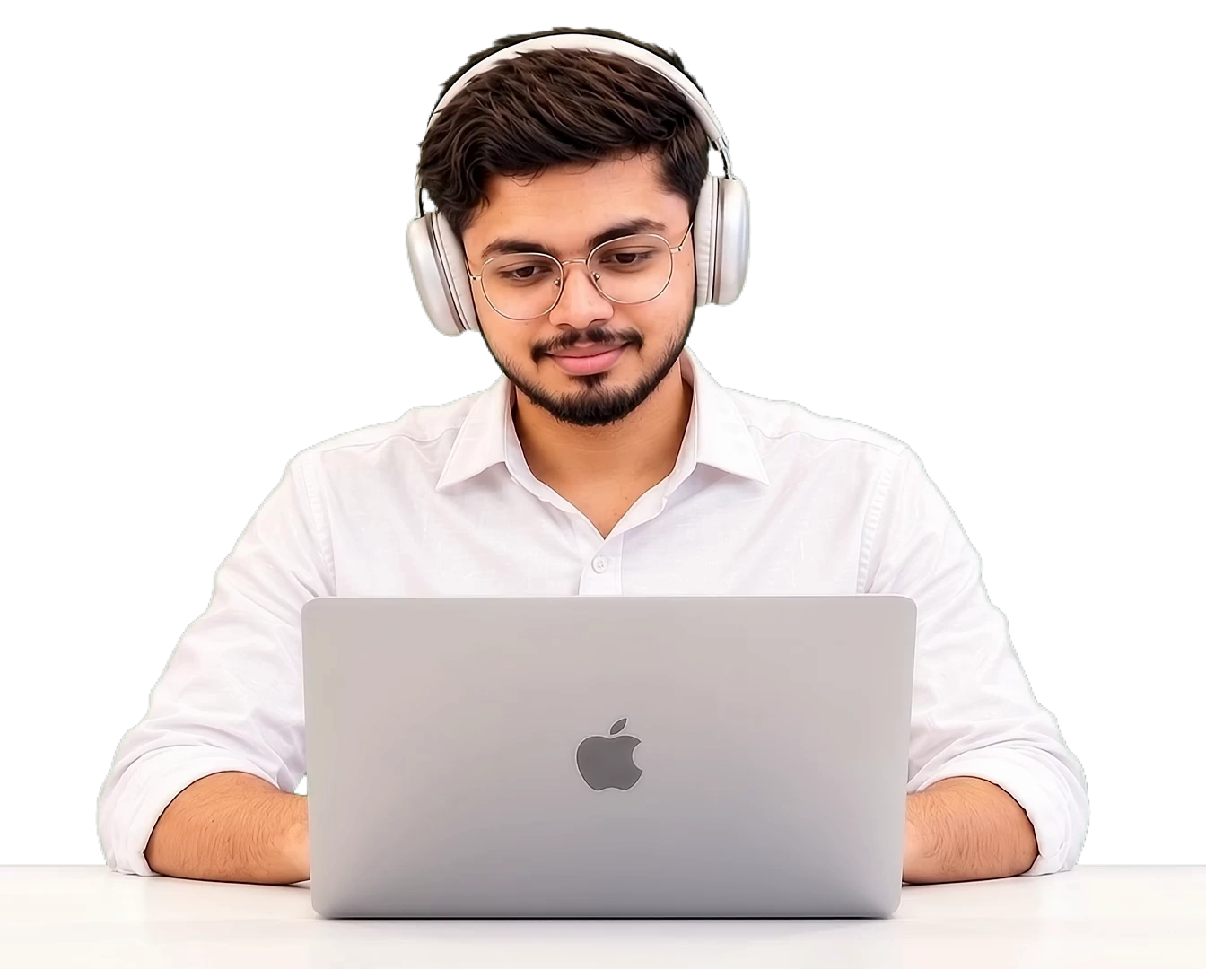 Ankur wearing headphones and working on his laptop